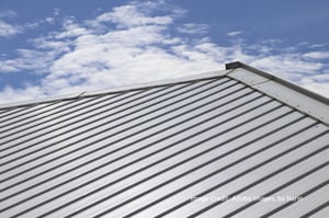 a metal roof with a blue sky in the background
